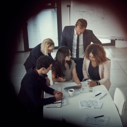 Group of persons having a business meeting