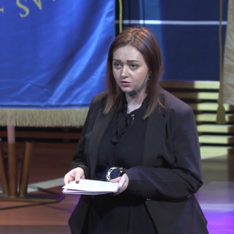 Disa Ahlblom-Berg, president of the Stockholm University Student Union, on stage in Aula Magna