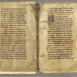 Uppslag i medeltida bok med handskriven text