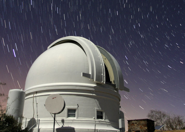 Telescope dome against night sky