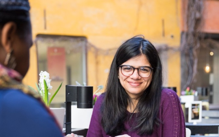 A student at a café in the Old Town of Stockholm.