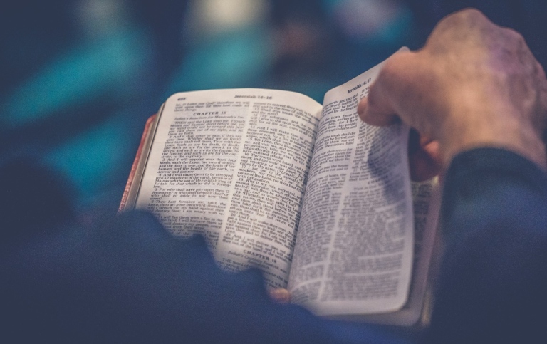 Turning the page of a Bible