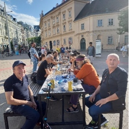 Chess players on a city square