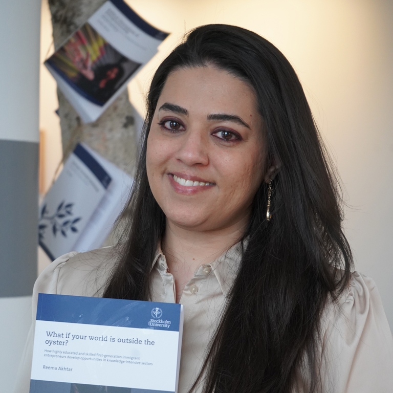 Reema Akhtar with her thesis What if your world is outside the oyster?