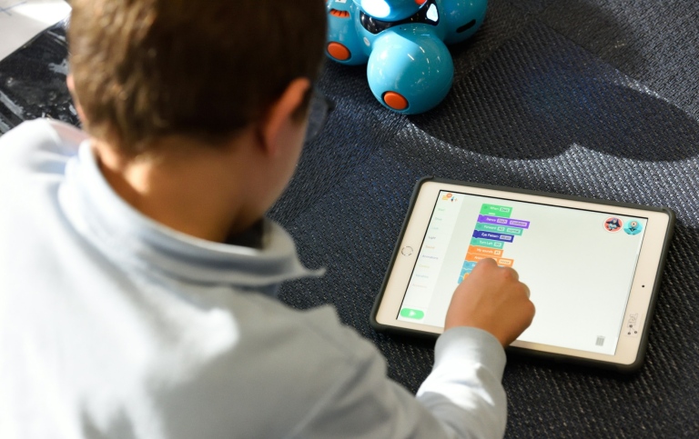 Schoolboy in the classroom with an iPad