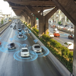 Illustration of the future self-driving vehicles on a motorway, digitally connected to each other.