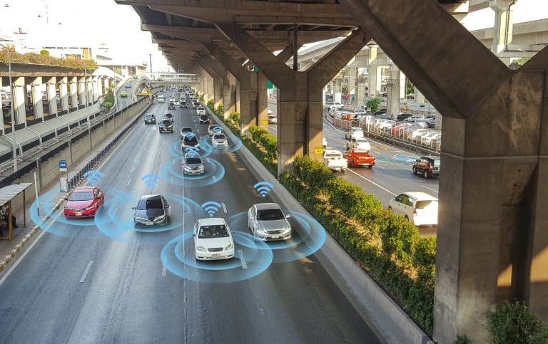 Illustration of the future self-driving vehicles on a motorway, digitally connected to each other.