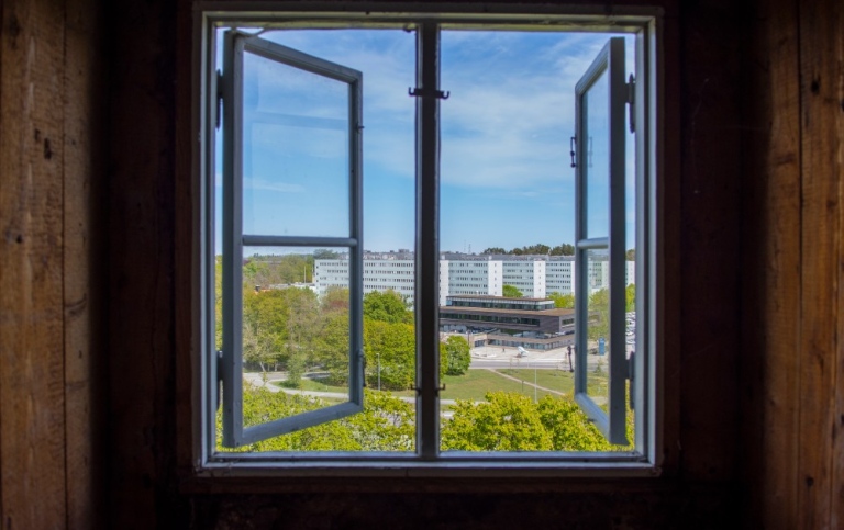 View through an open window towards the Frescati campus.