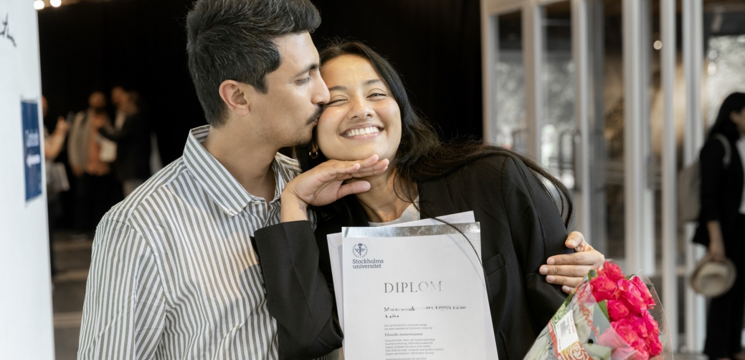Happy student being embraced and kissed on the cheek