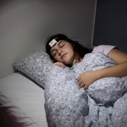 Young woman sleeping in the sleep lab.