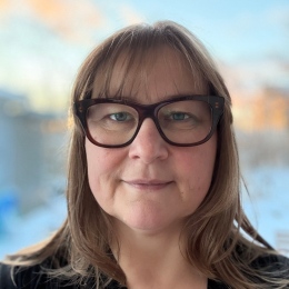 a portrait of Nicole Vickers with a blurred background.