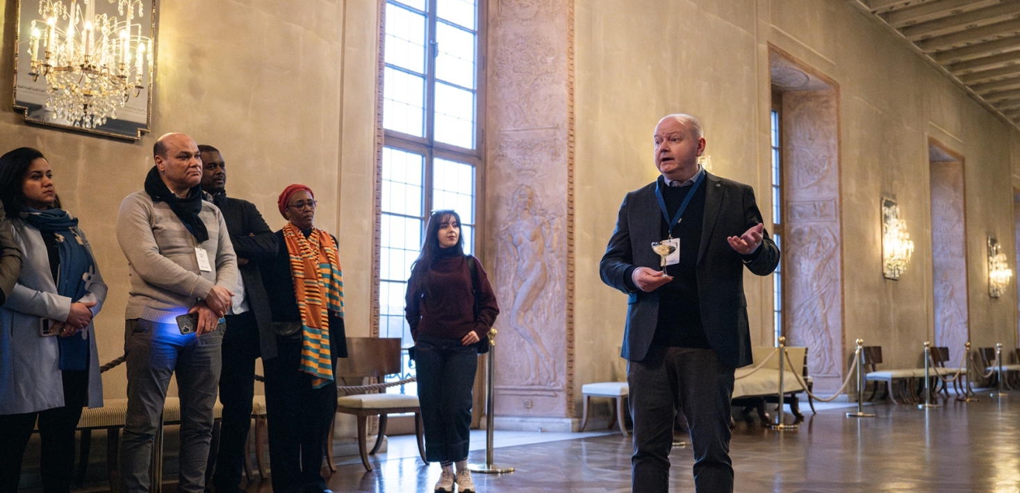 The president of Stockholm University talking in the Stockholm City Hall