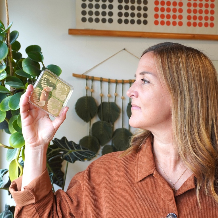Researcher Rike Stelkens holds up the wild yeast