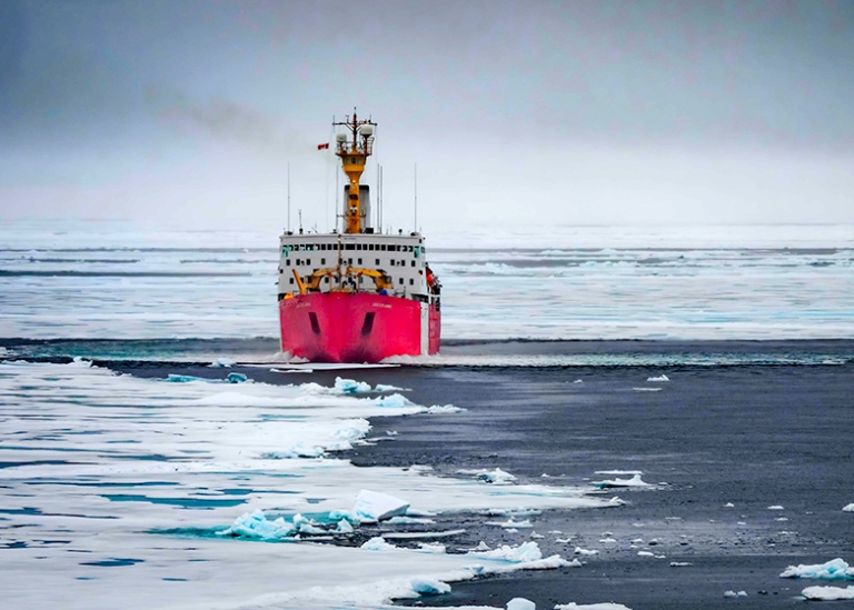 Icebreaker Luis in water and ice behind Oden, where the photo is taken from.