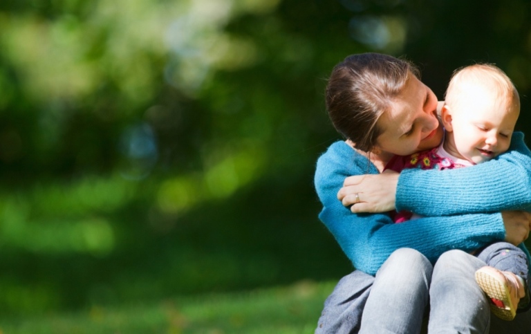 A mother holding her child in her arms
