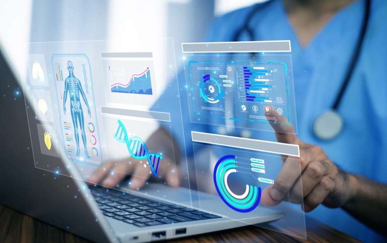 Doctors analyze digital health data on laptop