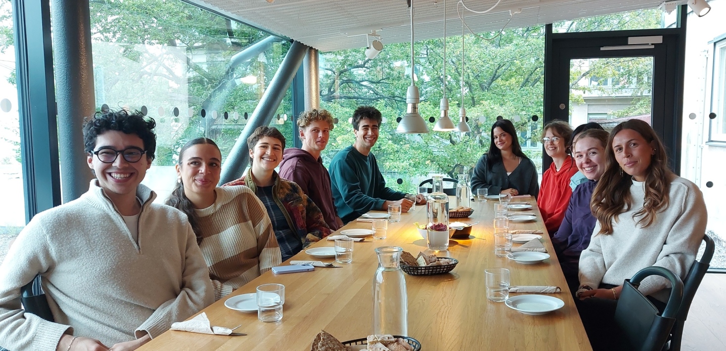 Students around a restaurant table.