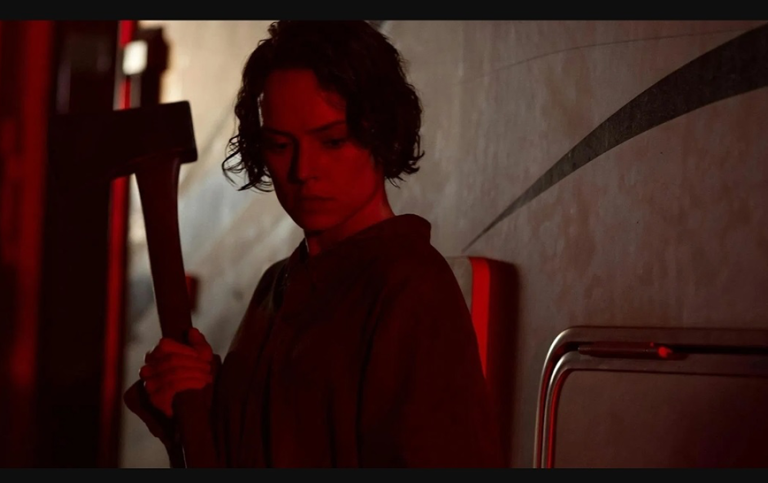 Screenshot from the move We bury the dead (2005), by Zak Hilditch. Woman holds ha hatch.