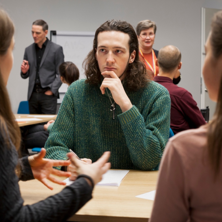 Students talking at a table