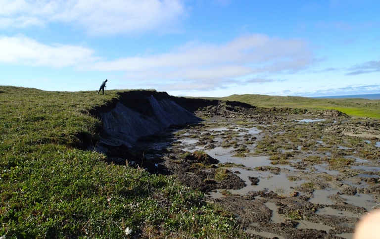 The photo shows an active thaw slump developing in ice rich permafrost along the Canadian coast