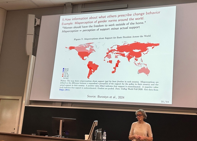 Marianne Bertrand during a lecture at Stockholm University