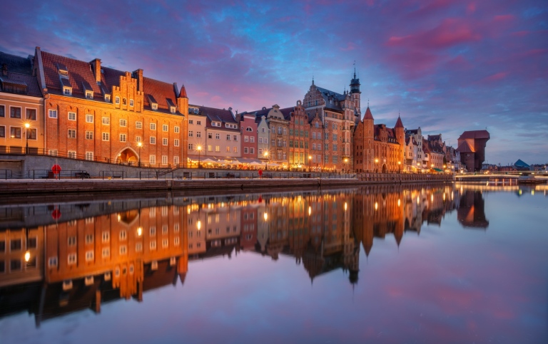 Picturesque waterfront with historic Hanseatic-style architecture.